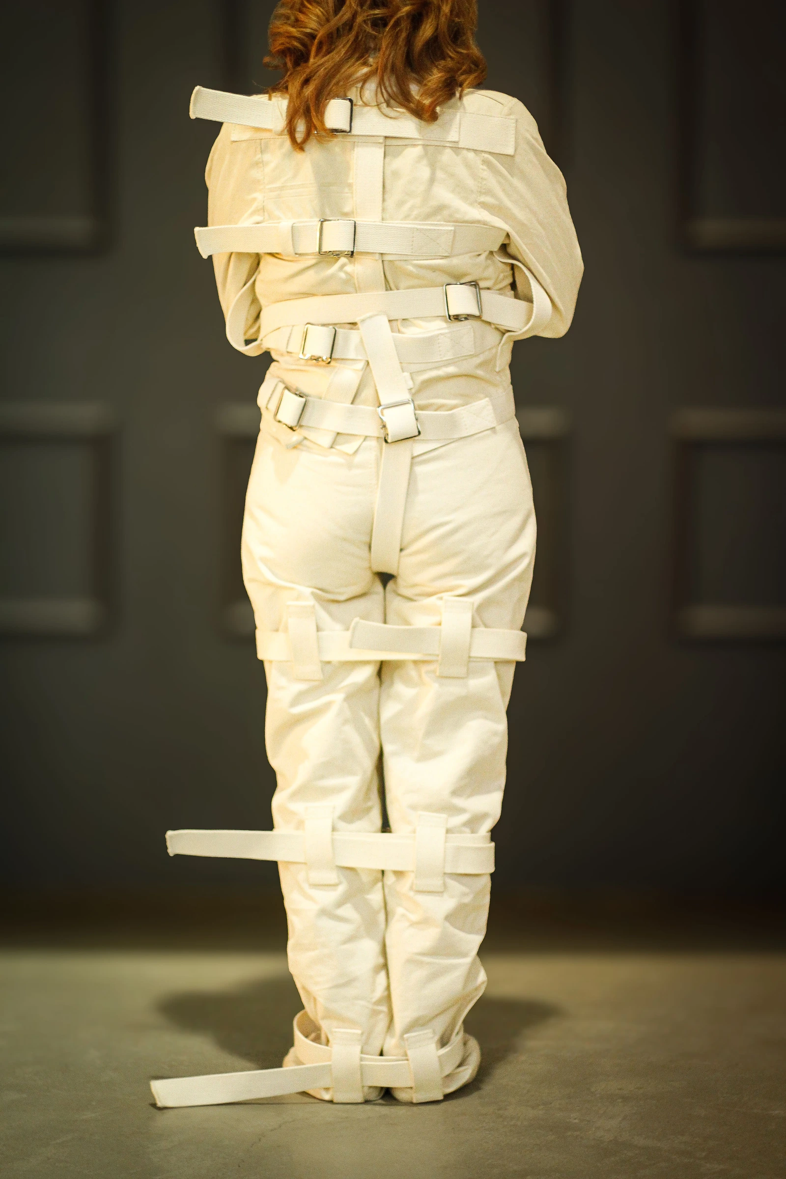 Full-length rear view of a Canvas Posey Replica showing the back straps.